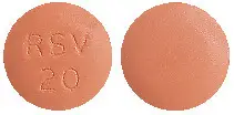 Front and back of terracotta coloured tablet. It is round, one side is incised RSV 20.. 